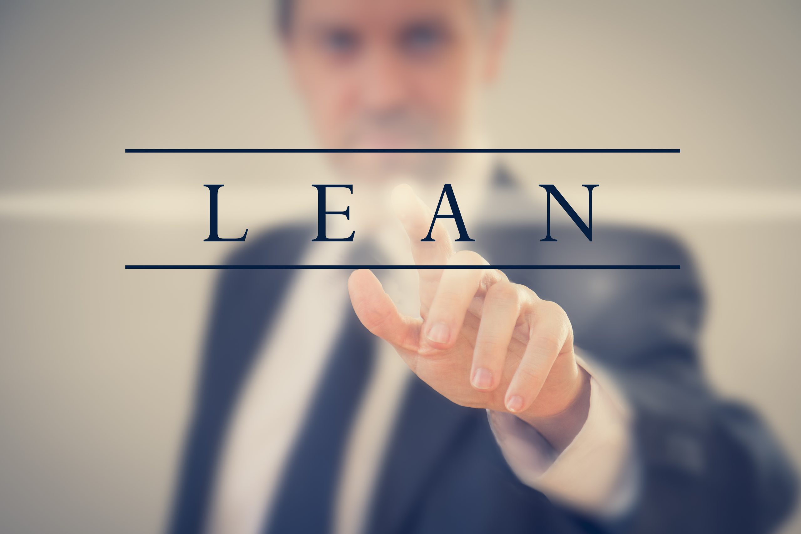 Business,Man,In,A,Suit,Touching,Word,"lean"
